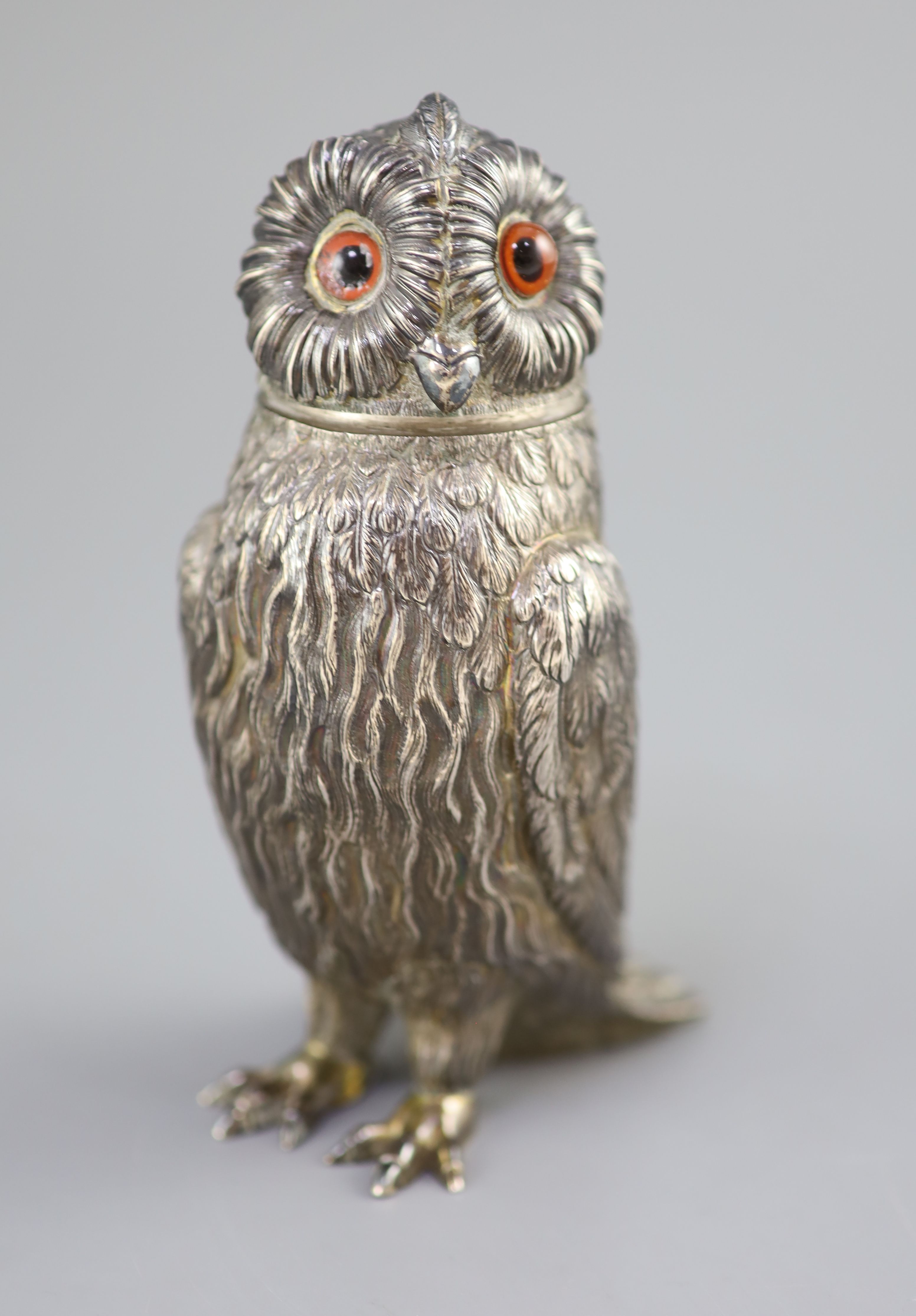 A Victorian silver owl sugar sifter, having chased feather decoration and removable head inset glass eyes,